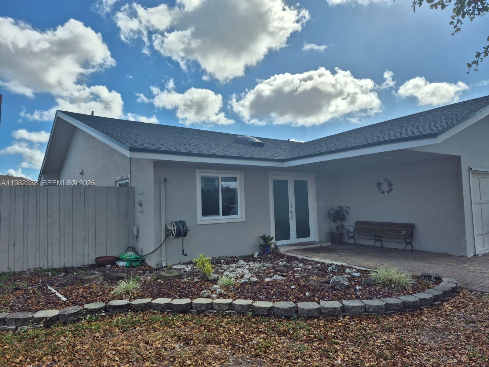 14530 Southwest 110th Street Miami, FL 33186 - Photo 3 of 45 a view of a house with a yard