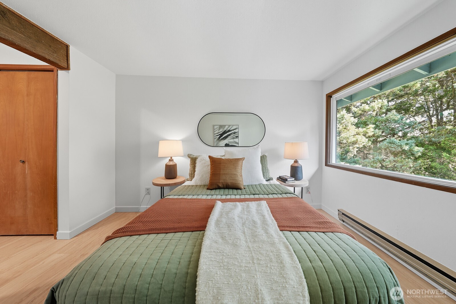 7573 Old Redmond Road, Unit 12 Redmond, WA 98052 - Photo 18 of 24 a bedroom with a bed and a large window