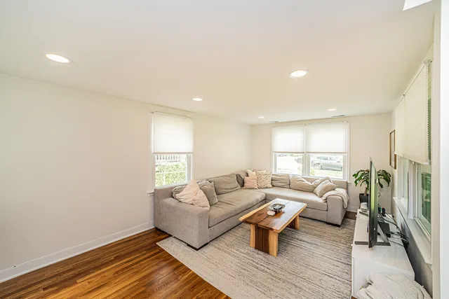 a living room with furniture and a table