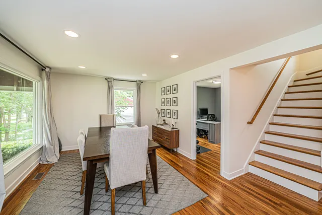 a view of a dining room with furniture window and wooden floor
