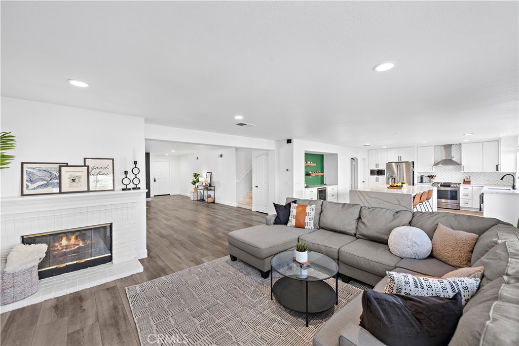4314 Silver Spring Way Oceanside, CA 92057 - Photo 12 of 49 a living room with furniture and a fireplace