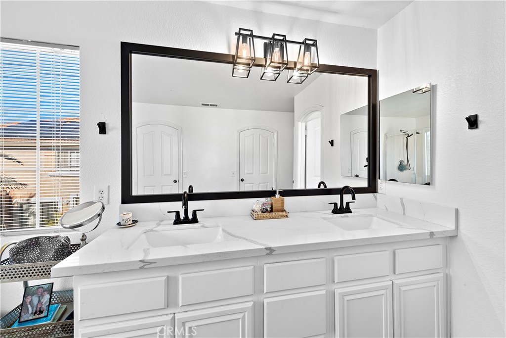 4314 Silver Spring Way Oceanside, CA 92057 - Photo 21 of 49 a bathroom with double vanity sink and two mirror