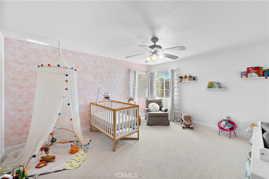 4314 Silver Spring Way Oceanside, CA 92057 - Photo 22 of 49 a bedroom with furniture and a chandelier