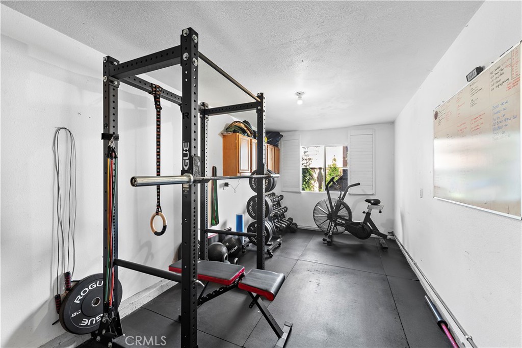 4314 Silver Spring Way Oceanside, CA 92057 - Photo 32 of 49 a view of a room with gym equipment