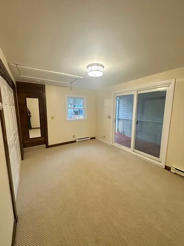 an empty room with a empty space and windows