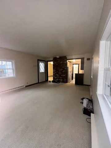 a kitchen with a refrigerator and a sink