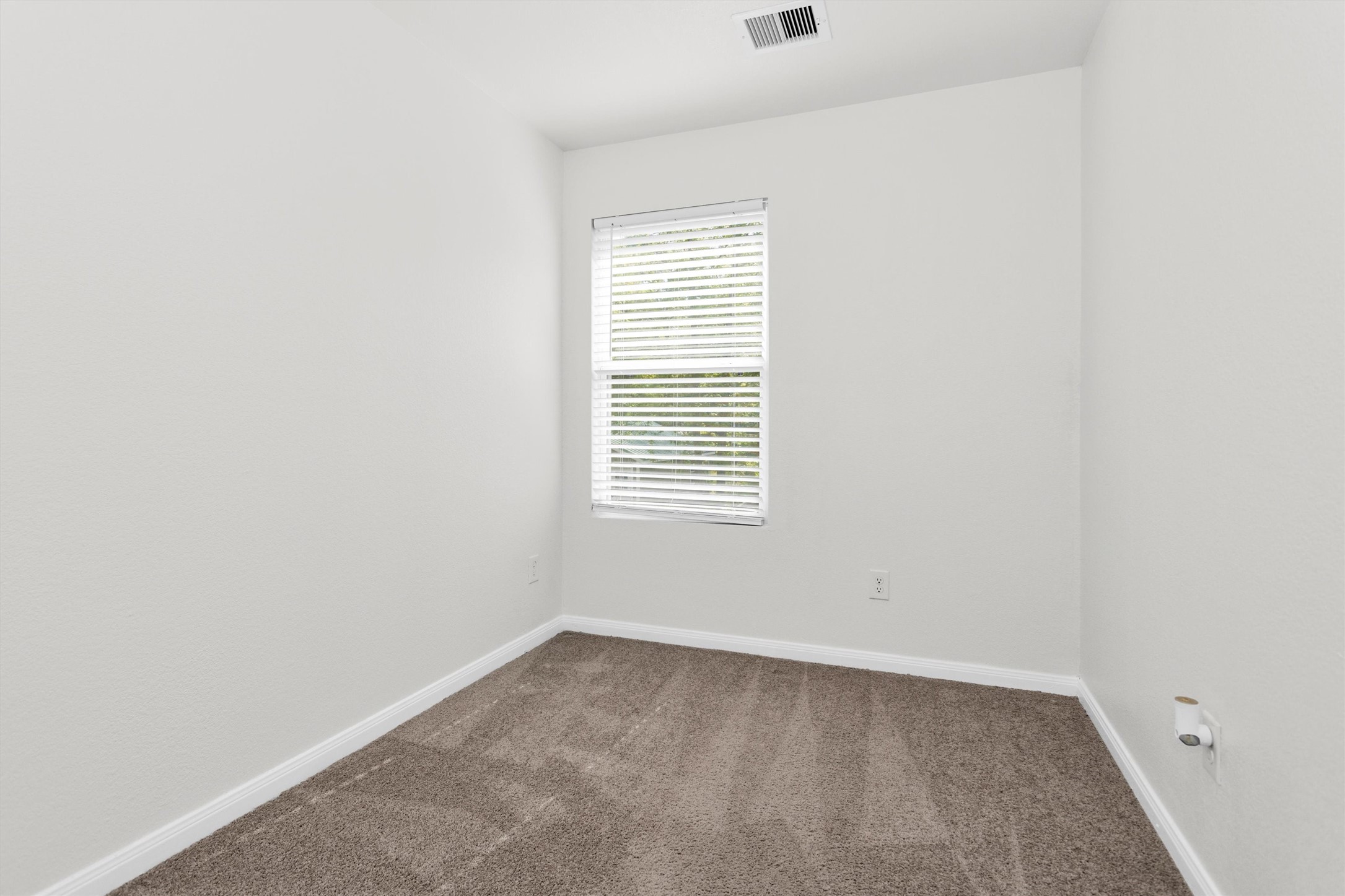 15134 Austin Road Willis, TX 77378 - Photo 15 of 20 an empty room with a window
