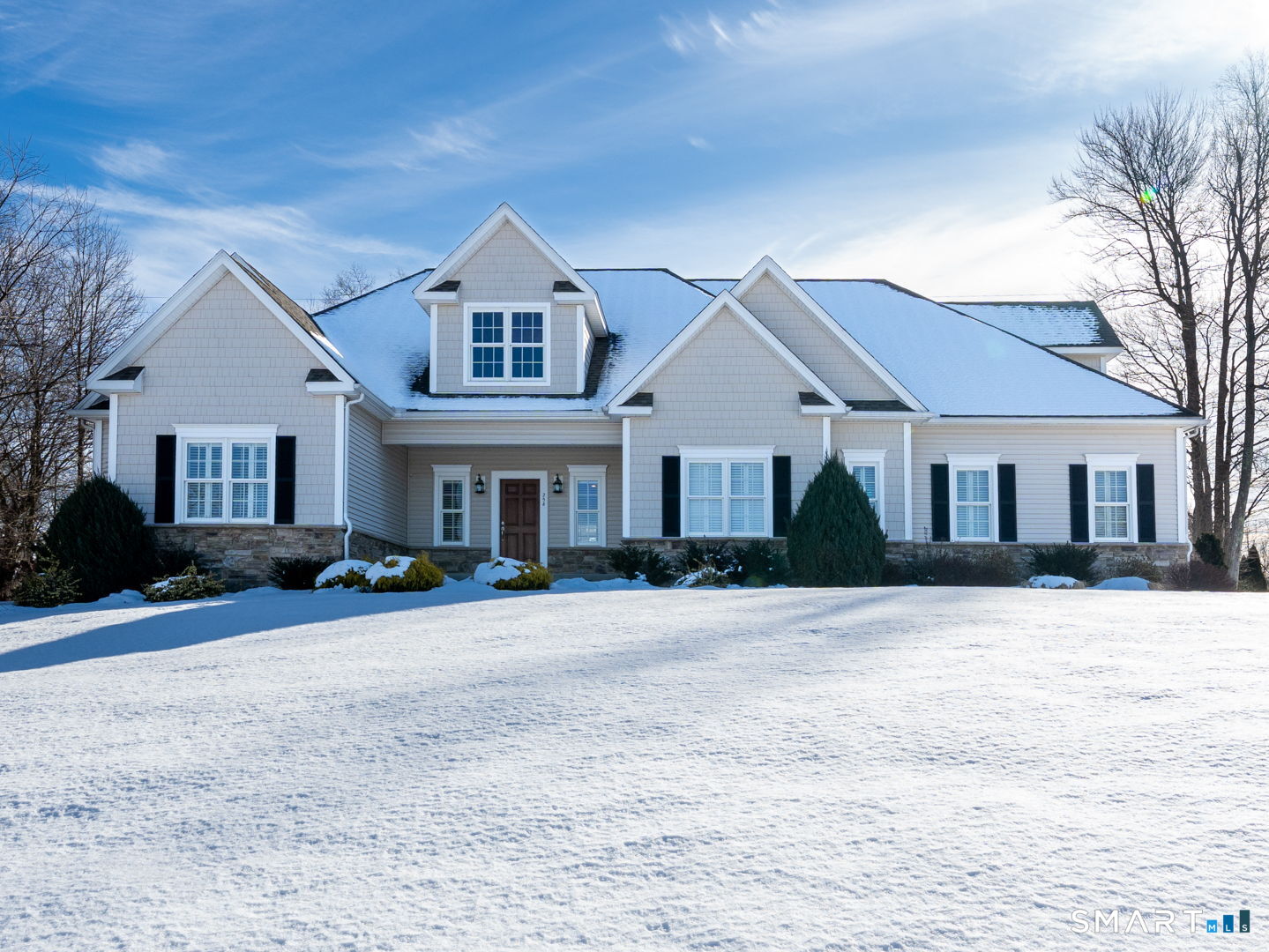 a front view of a house with a yard