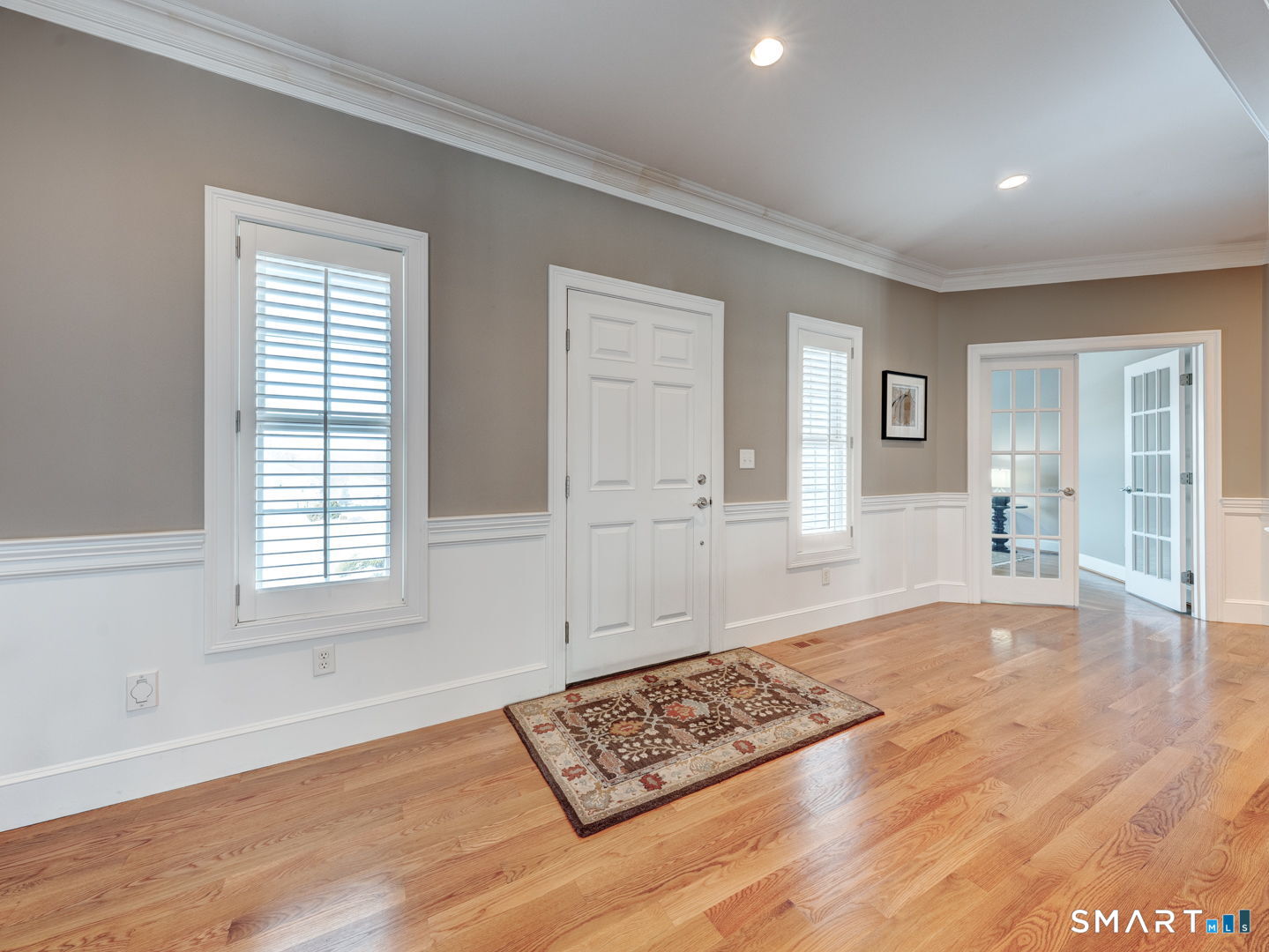 254 Sunset Ridge Rocky Hill, CT 06067 - Photo 4 of 40 a view of an empty room with wooden floor and a window