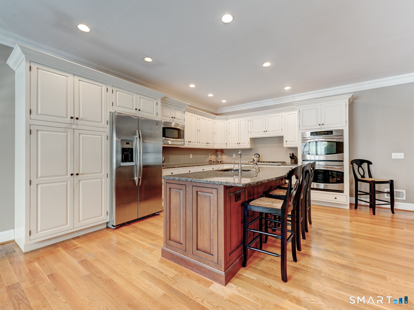 254 Sunset Ridge Rocky Hill, CT 06067 - Photo 8 of 40 a kitchen with stainless steel appliances granite countertop a table chairs sink refrigerator and cabinets