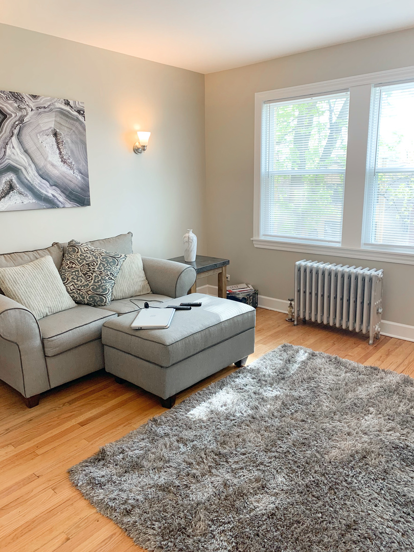 1921 Grove Avenue, Unit 37 Berwyn, IL 60402 - Photo 4 of 18 a living room with furniture and a rug