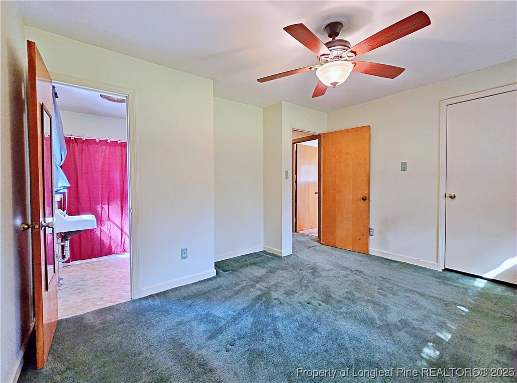 764 Old Vander Road Fayetteville, NC 28312 - Photo 24 of 50 an empty room with closet and a chandelier fan
