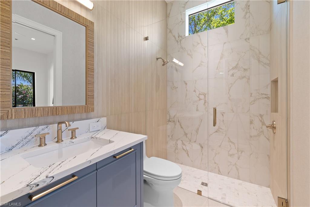 850 10th Street North Naples, FL 34102 - Photo 23 of 50 2nd bedroom en-suite bathroom