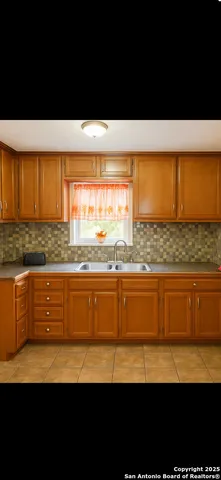 a view of open kitchen with wooden floor