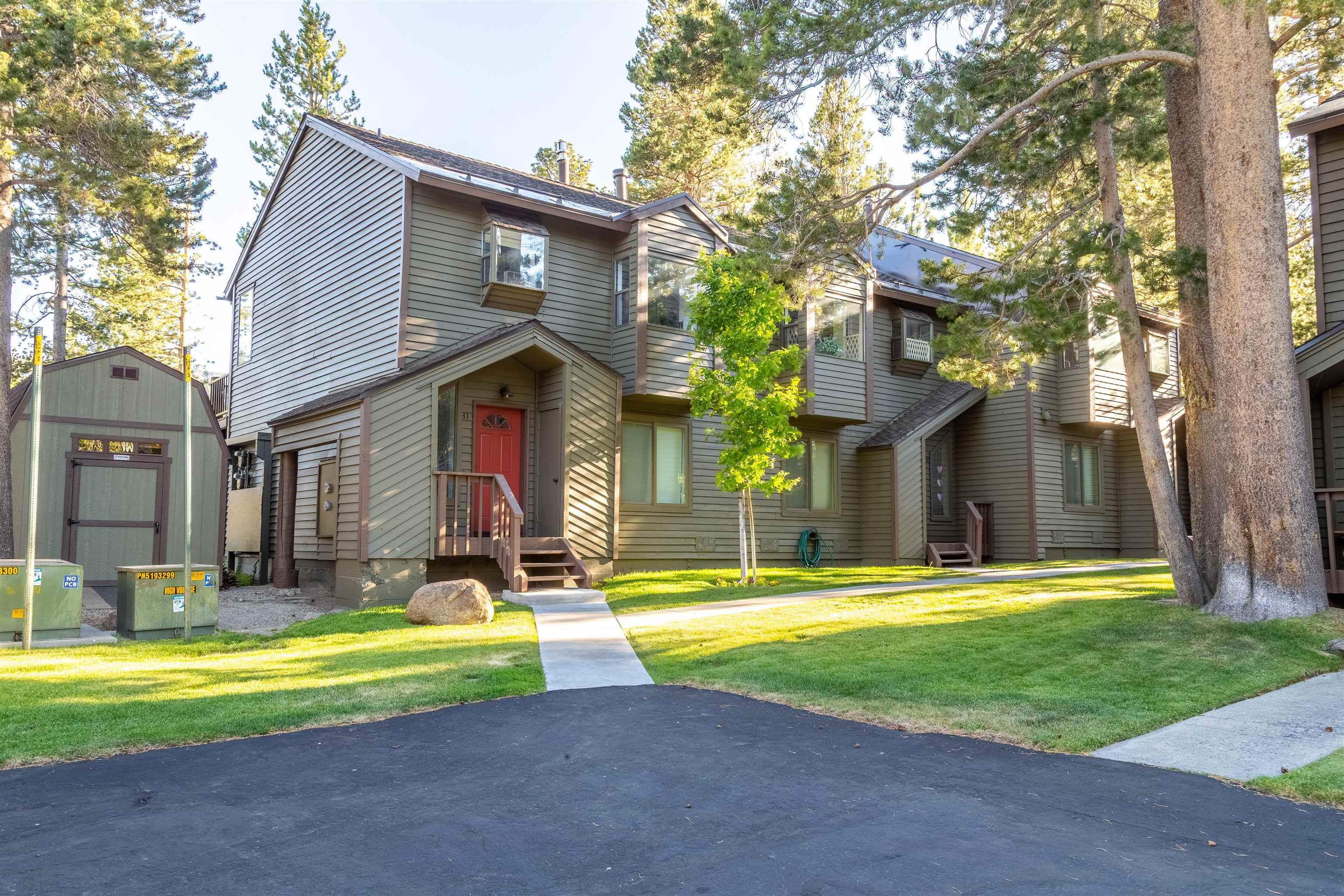 384 Joaquin Road, Unit 31 Mammoth Lakes, CA 93546 - Photo 24 of 29 View of front facade with a storage shed and a front lawn