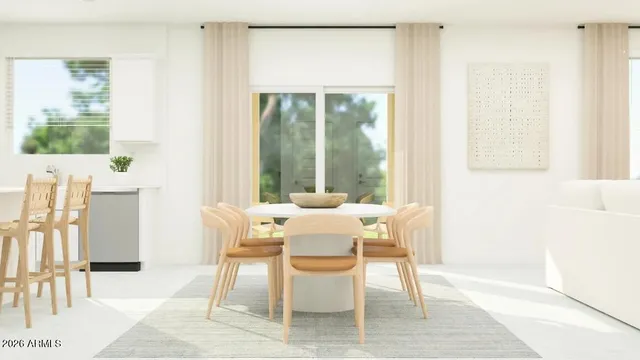 a kitchen with stainless steel appliances white cabinets and a refrigerator