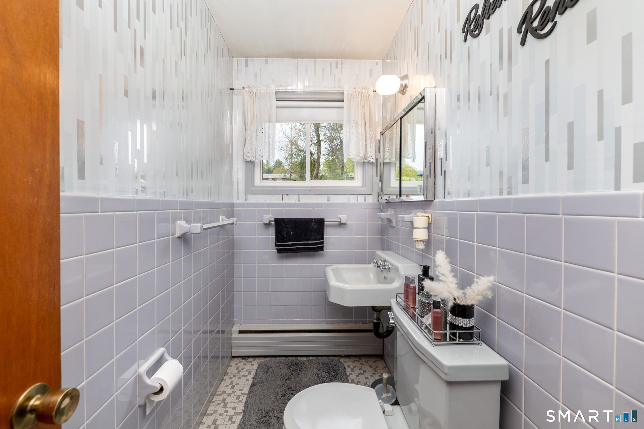 325 Barbara Road Middletown, CT 06457 - Photo 31 of 40 a bathroom with a toilet a sink and mirror