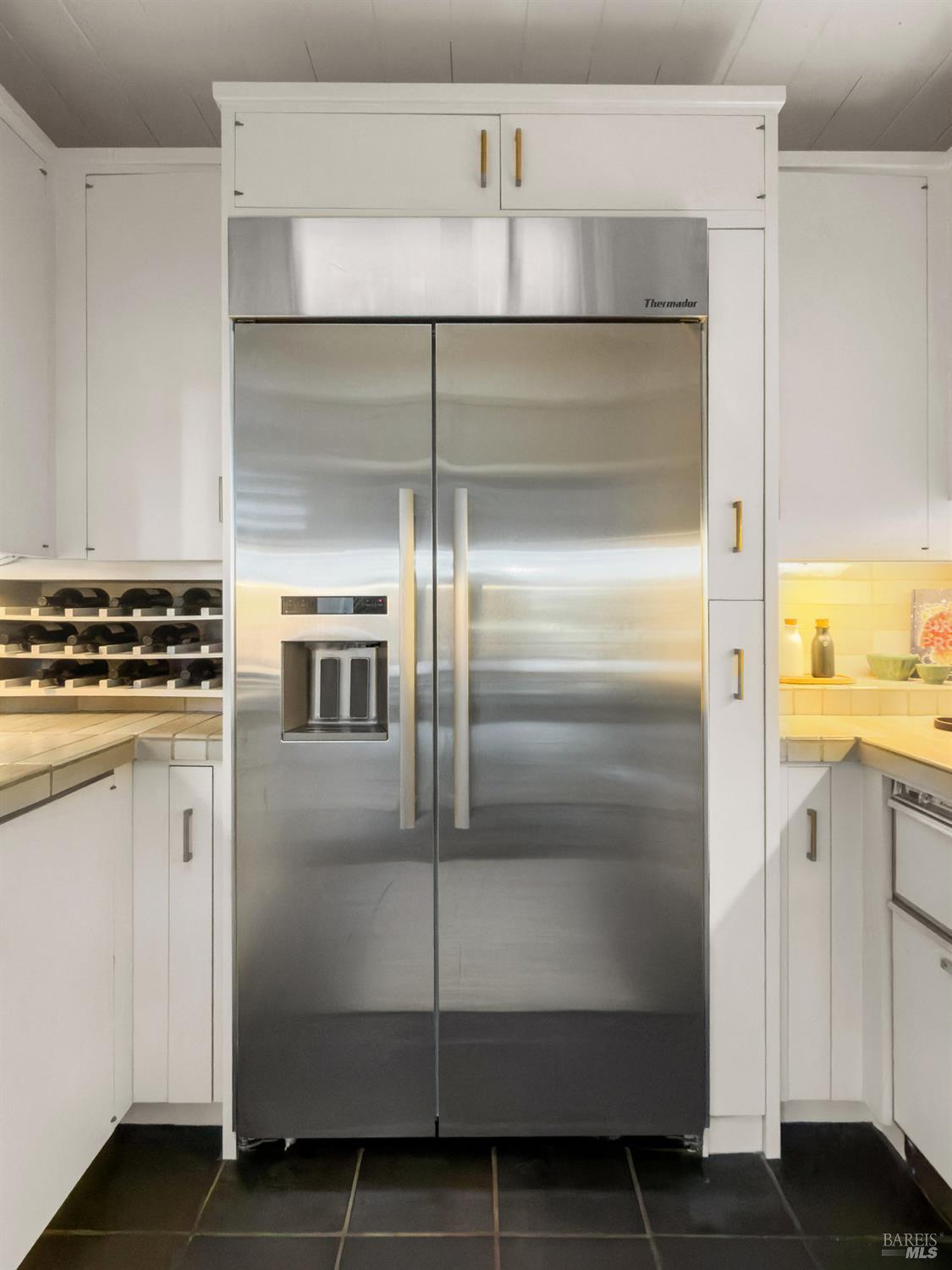 300 Hazel Avenue Mill Valley, CA 94941 - Photo 11 of 50 a kitchen with cabinets and stainless steel appliances
