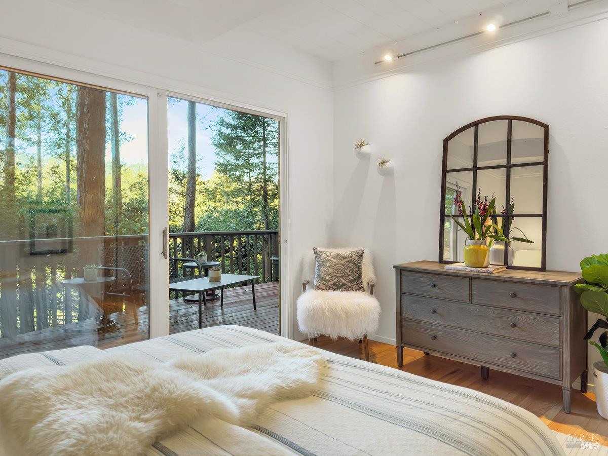 300 Hazel Avenue Mill Valley, CA 94941 - Photo 12 of 50 a bedroom with a large bed and a window