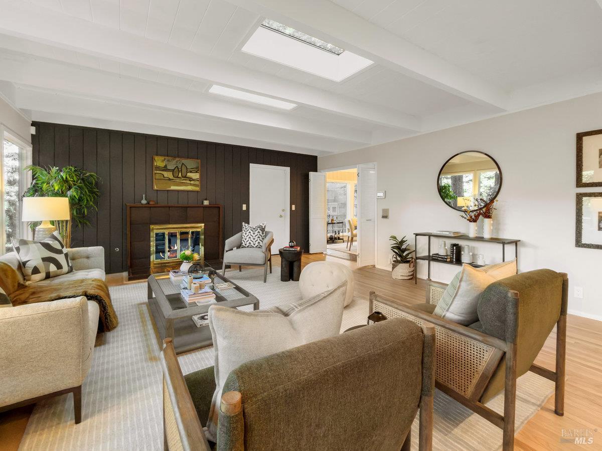 300 Hazel Avenue Mill Valley, CA 94941 - Photo 3 of 50 a living room with furniture a fireplace and a large window