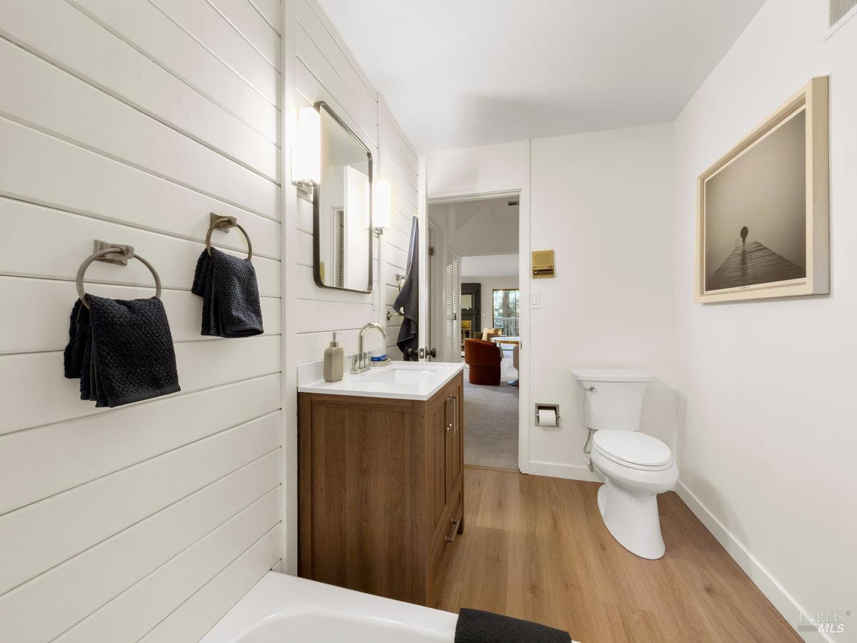 300 Hazel Avenue Mill Valley, CA 94941 - Photo 31 of 50 a bathroom with a toilet sink and mirror