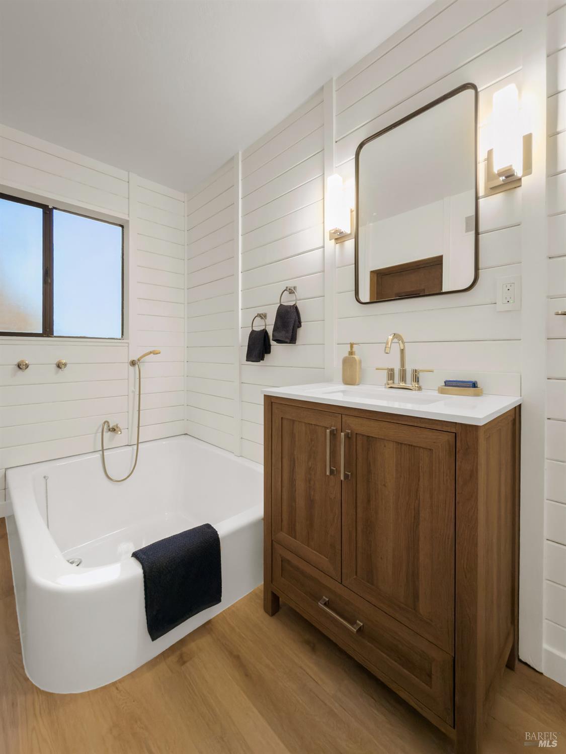 300 Hazel Avenue Mill Valley, CA 94941 - Photo 32 of 50 a bathroom with a tub sink and mirror