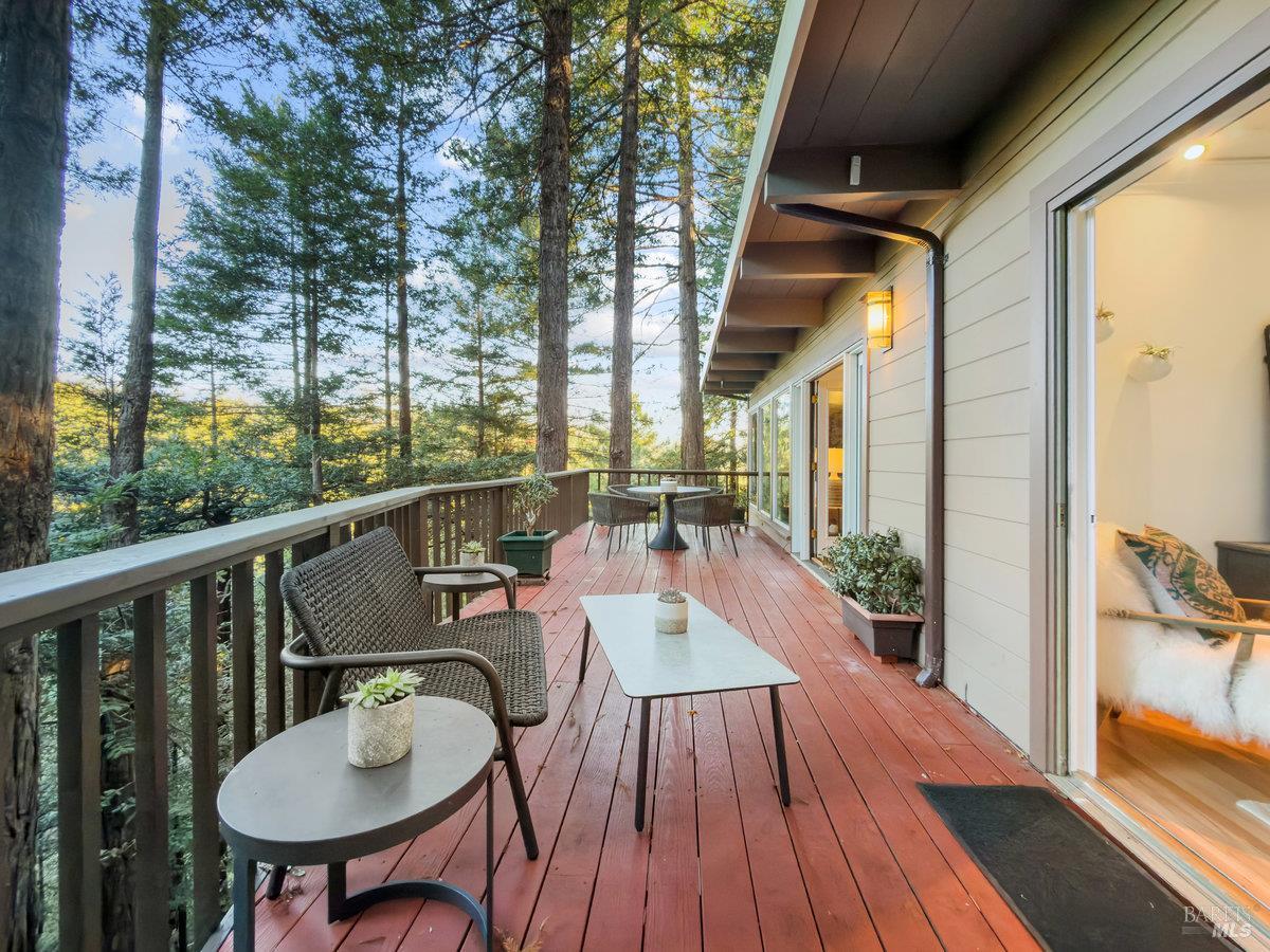300 Hazel Avenue Mill Valley, CA 94941 - Photo 37 of 50 a balcony with wooden floor table and chairs