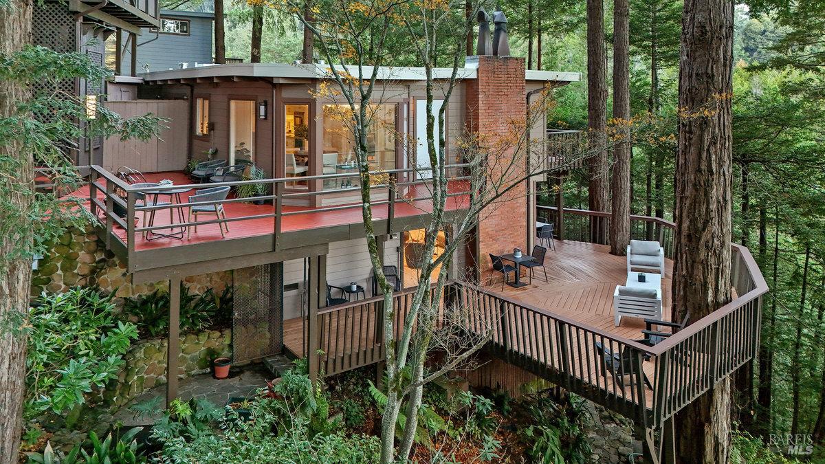 300 Hazel Avenue Mill Valley, CA 94941 - Photo 46 of 50 a view of a house with large windows and wooden fence