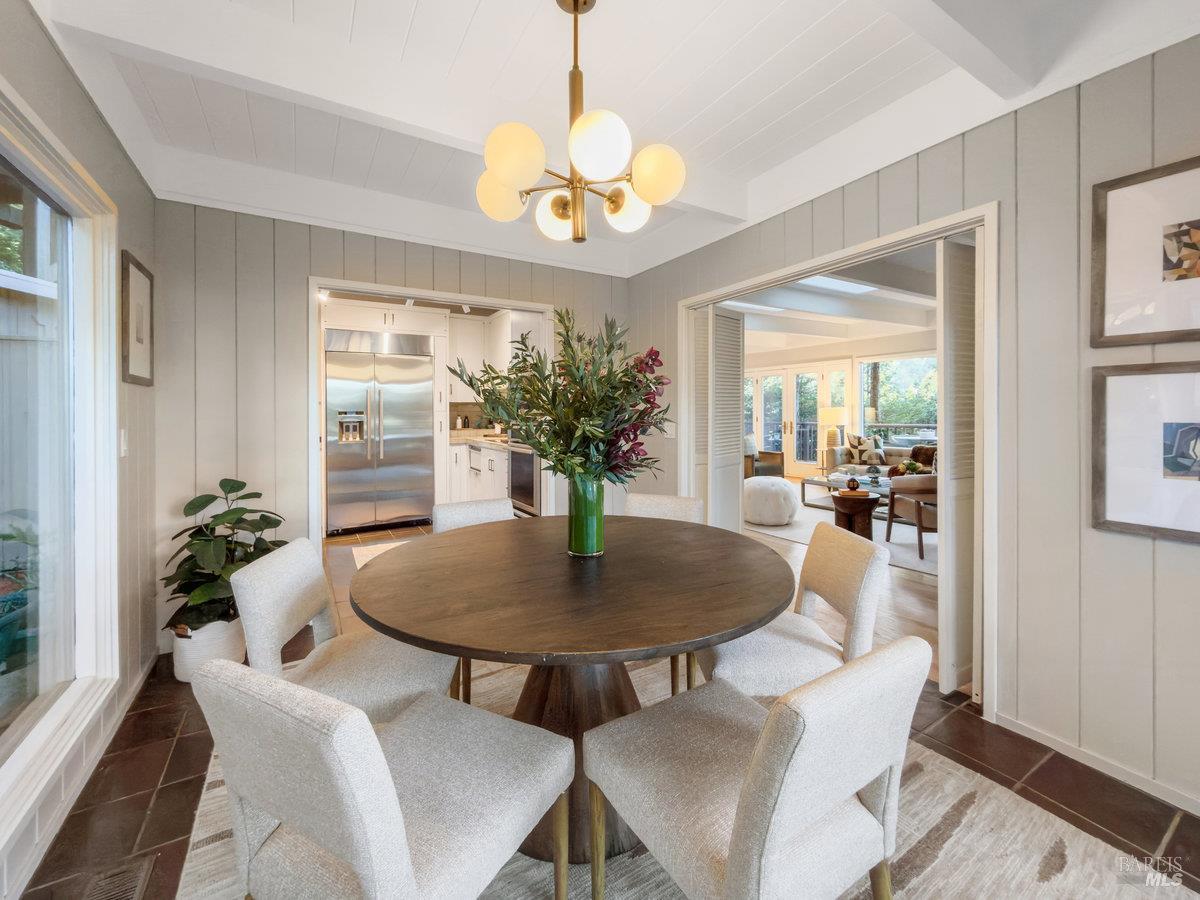 300 Hazel Avenue Mill Valley, CA 94941 - Photo 6 of 50 a dining room with chandelier and wooden floor