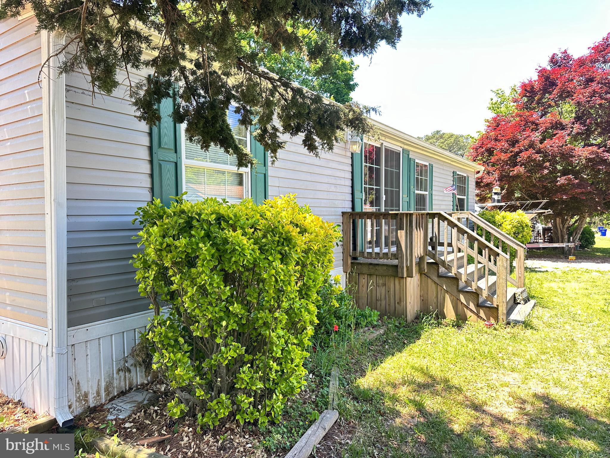 35390 Heron Road Millsboro, DE 19966 - Photo 2 of 25 a front view of a house with a yard