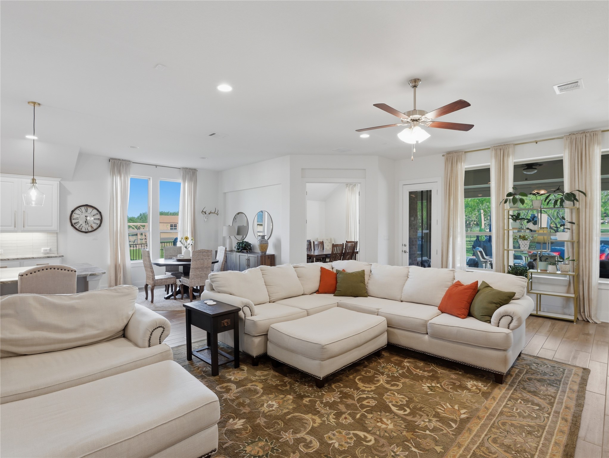 316 Raptor Beak Way Cedar Creek, TX 78612 - Photo 12 of 30 a living room with furniture ceiling fan and a rug