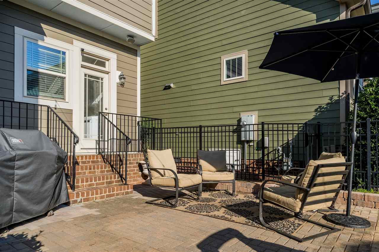 1528 Rodessa Run Raleigh, NC 27607 - Photo 28 of 30 Fenced backyard, enlarged patio, grass to play and landscaping maintained by the HOA. Backyard