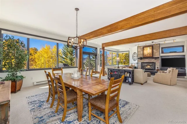 a kitchen with granite countertop a sink a counter space stainless steel appliances and cabinets