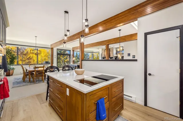 a spacious bedroom with a bed and a flat screen tv