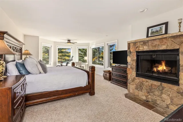 a bedroom with a bed and a dresser in it