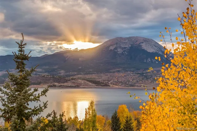 a view of a house with pool and sitting area