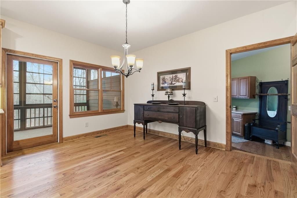 11 Poplar Circle Big Canoe, GA 30143 - Photo 11 of 34 a workspace with wooden floor and furniture
