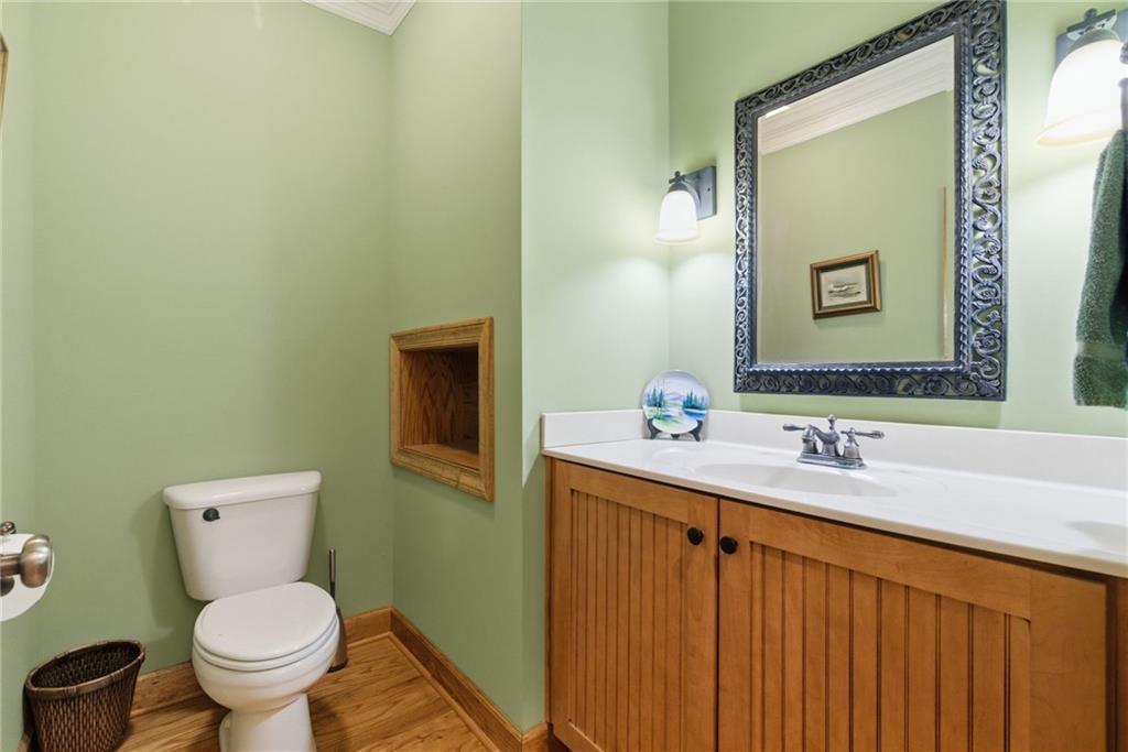 11 Poplar Circle Big Canoe, GA 30143 - Photo 13 of 34 a bathroom with a toilet sink and mirror