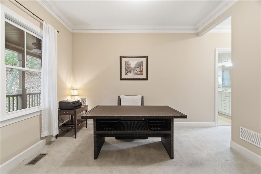11 Poplar Circle Big Canoe, GA 30143 - Photo 16 of 34 a room with a table chairs and a window
