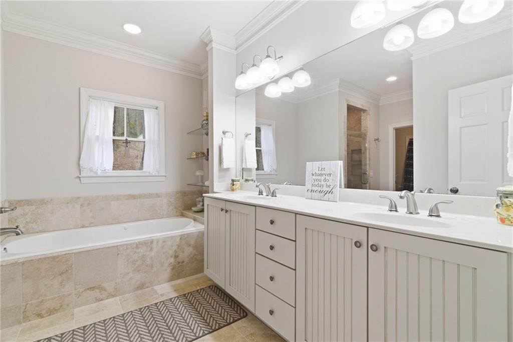 11 Poplar Circle Big Canoe, GA 30143 - Photo 17 of 34 a spacious bathroom with a double vanity sink mirror and bathtub