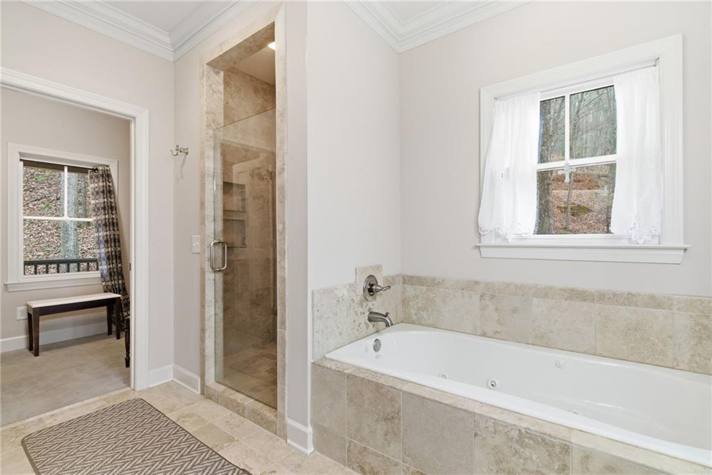 11 Poplar Circle Big Canoe, GA 30143 - Photo 18 of 34 a white bath tub sitting next to a window