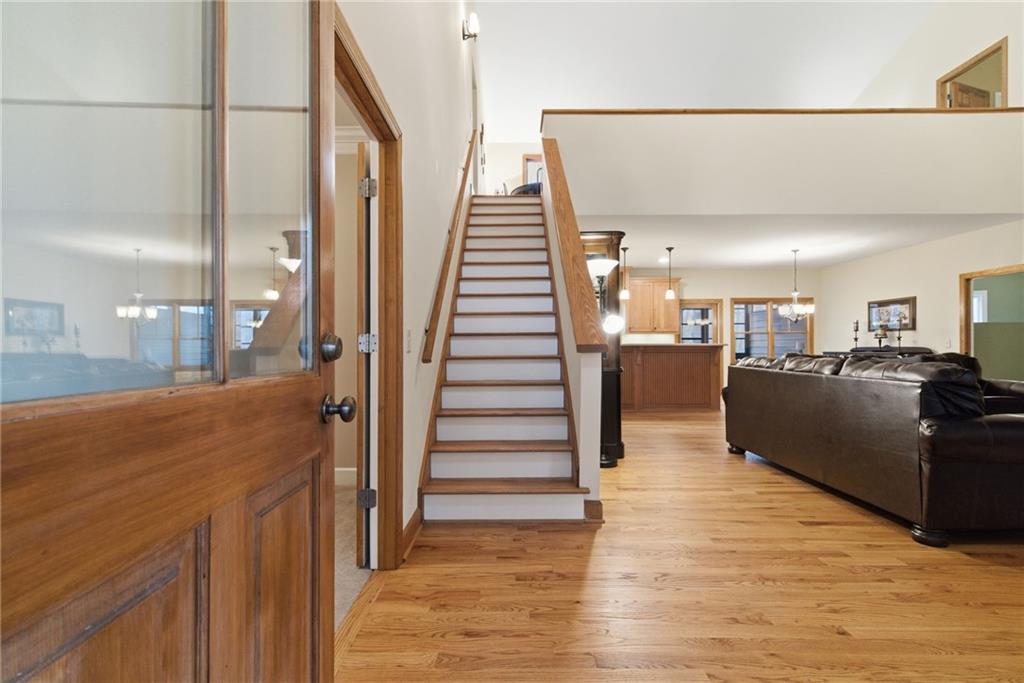 11 Poplar Circle Big Canoe, GA 30143 - Photo 19 of 34 a view of a living room with wooden floor and stairs