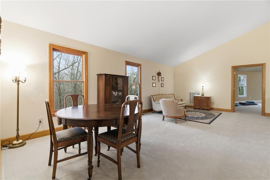 11 Poplar Circle Big Canoe, GA 30143 - Photo 21 of 34 a living room with furniture a lamp and a large window
