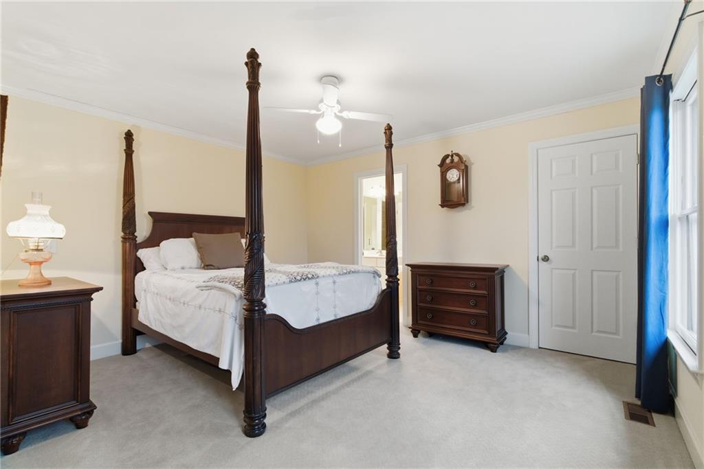 11 Poplar Circle Big Canoe, GA 30143 - Photo 22 of 34 a bed room with a bed and a night stand