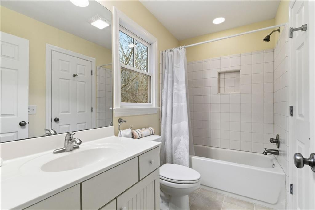 11 Poplar Circle Big Canoe, GA 30143 - Photo 25 of 34 a bathroom with a sink toilet tub and shower