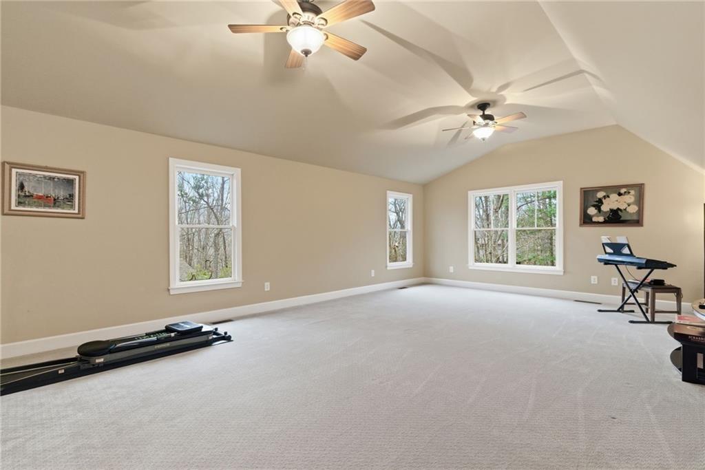 11 Poplar Circle Big Canoe, GA 30143 - Photo 29 of 34 a view of a livingroom with furniture and a window