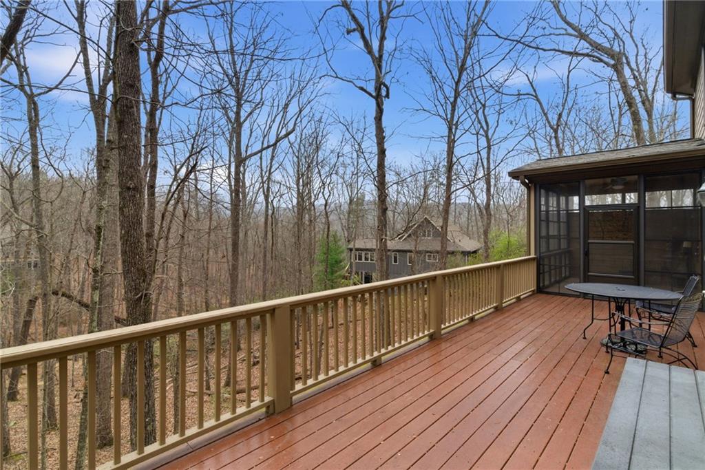 11 Poplar Circle Big Canoe, GA 30143 - Photo 3 of 34 a view of balcony with wooden floor and outdoor seating