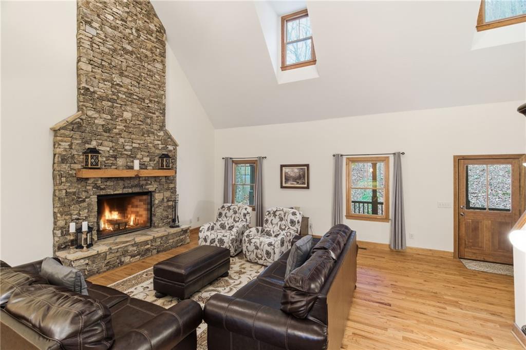 11 Poplar Circle Big Canoe, GA 30143 - Photo 5 of 34 a living room with furniture and a fireplace