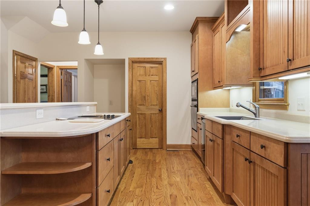 11 Poplar Circle Big Canoe, GA 30143 - Photo 9 of 34 a kitchen with a sink stove and refrigerator