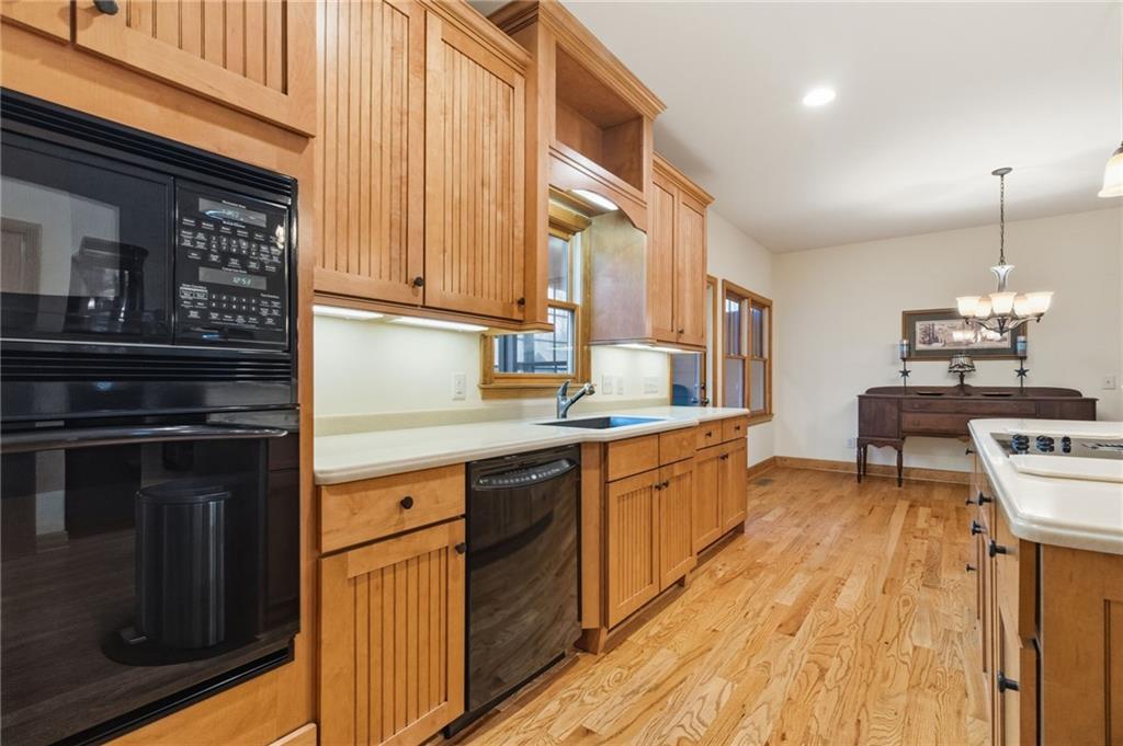 11 Poplar Circle Big Canoe, GA 30143 - Photo 10 of 34 a kitchen with stainless steel appliances granite countertop a stove and a sink